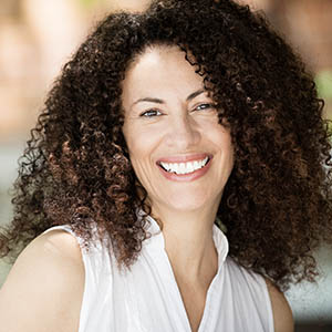 woman smiling after general dentistry