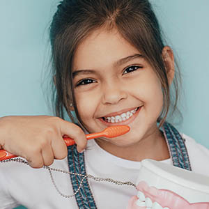 girl smiling after pediatric dentistry