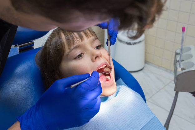 pediatric dental emergency (1) young girl at the dentist for Pediatric Dental Emergency