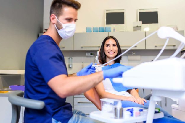 a doctor performing dental health services