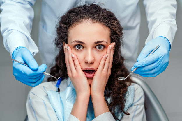 a woman suffering from dentophobia