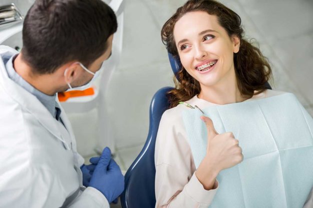 1-3-Benefits-of-Adult-Orthodontic-Services- woman learns about the benefits of adult orthodontics