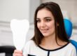 adult patient looking at dental braces