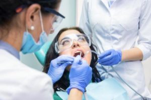 woman learning about specialty dental services